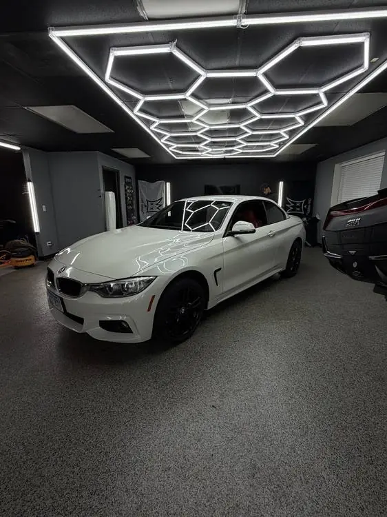 White BMW 4 Series inside the PRM Eurowerks shop in Cary, IL